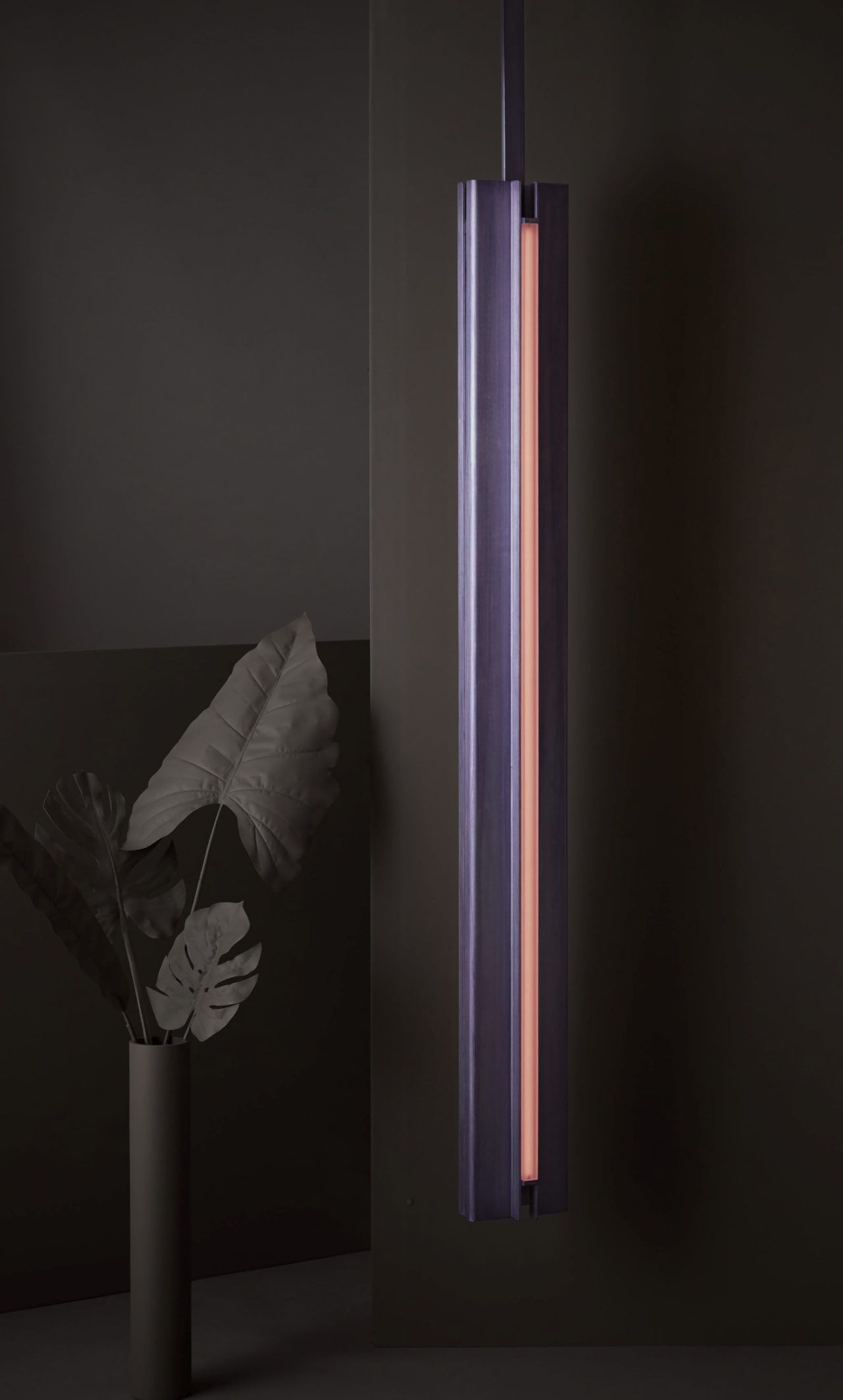 Three quarter view of Pelle’s Glow 06 Pendant in hand-stained lilac with rose lens.