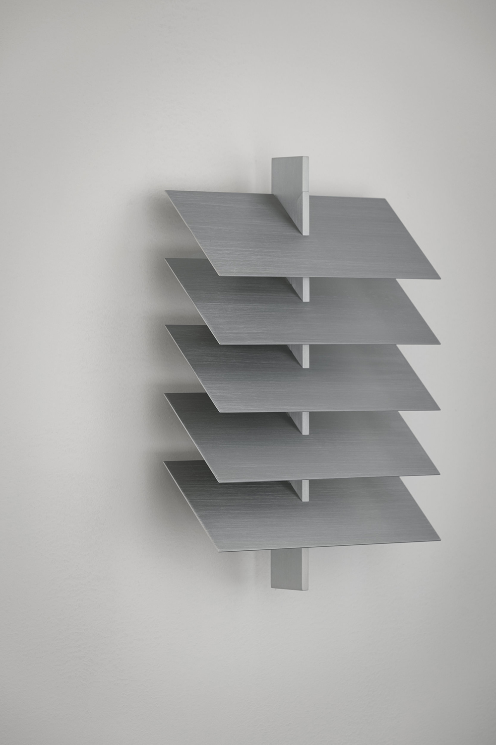 Pelle’s Be Patient wall lamp, made of hand-finished aluminum louvers.